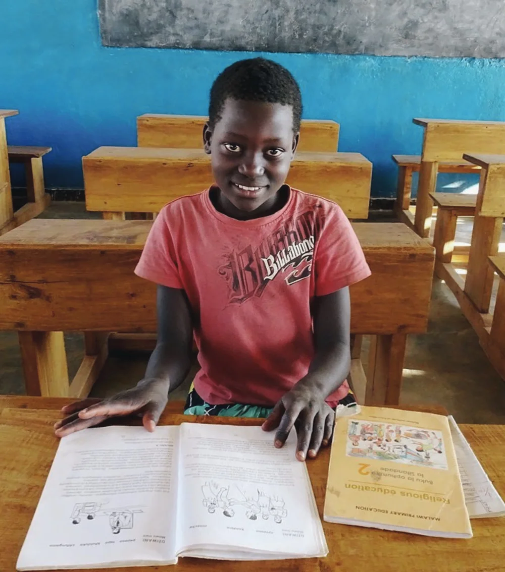 A student in a Malawian classroom